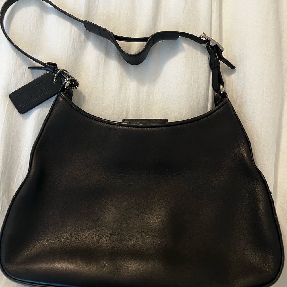 Small black coach bag. Few scuffs but overall good condition.